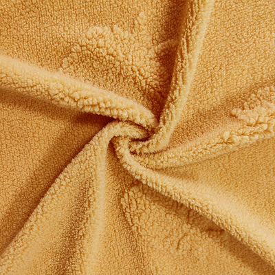 Sherpa tricoté par chaîne tondre le jacquard 100% jaune de polyester de tissu pour le vêtement