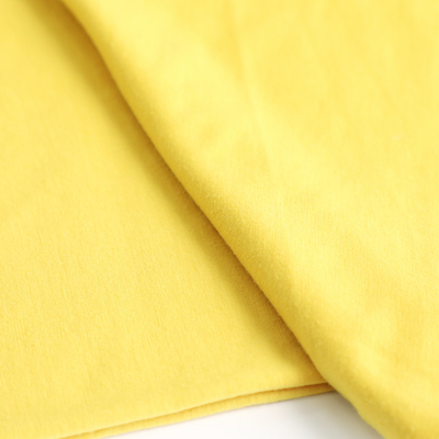Le coton a tricoté le tissu simple 100gsm de débardeur pour la chemise met en sac le revêtement