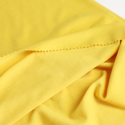 Le coton a tricoté le tissu simple 100gsm de débardeur pour la chemise met en sac le revêtement